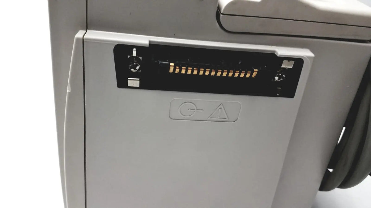 Gray printer showing black connector slot and warning symbol beside 60 count medical isolation gown level 2 00001-LIN product