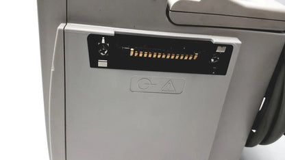 Gray printer showing black connector slot and warning symbol beside 60 count medical isolation gown level 2 00001-LIN product