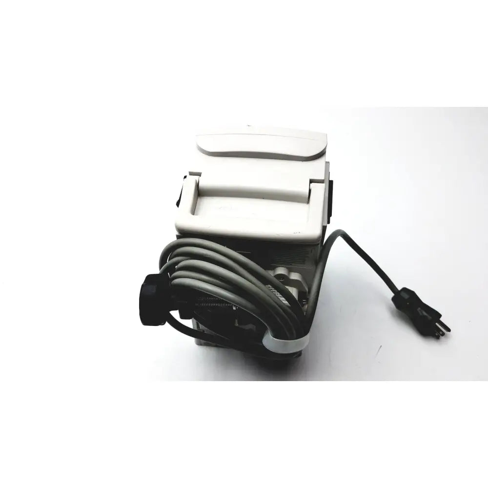 White plastic electric paper cutter with black power cord and plug for medical isolation gown level 2 cutting tasks