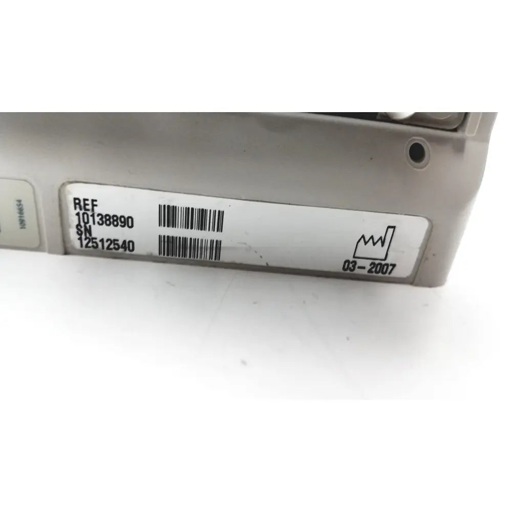 Silver metal engine control unit with label shown alongside 60 count medical isolation gown level 2 product details