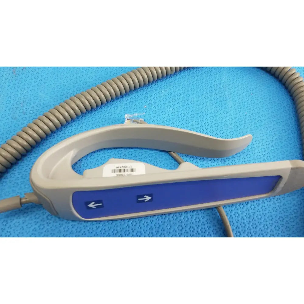 Gray and blue remote control with coiled cord for patient lift chair 700-13865 offering two functions