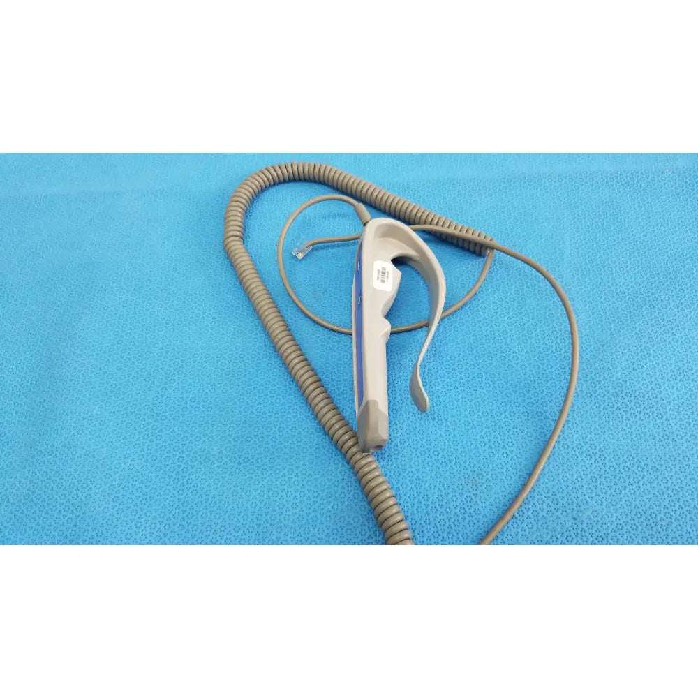Gray and white remote control with coiled cord for patient lift chair featuring two functions for patient lift use