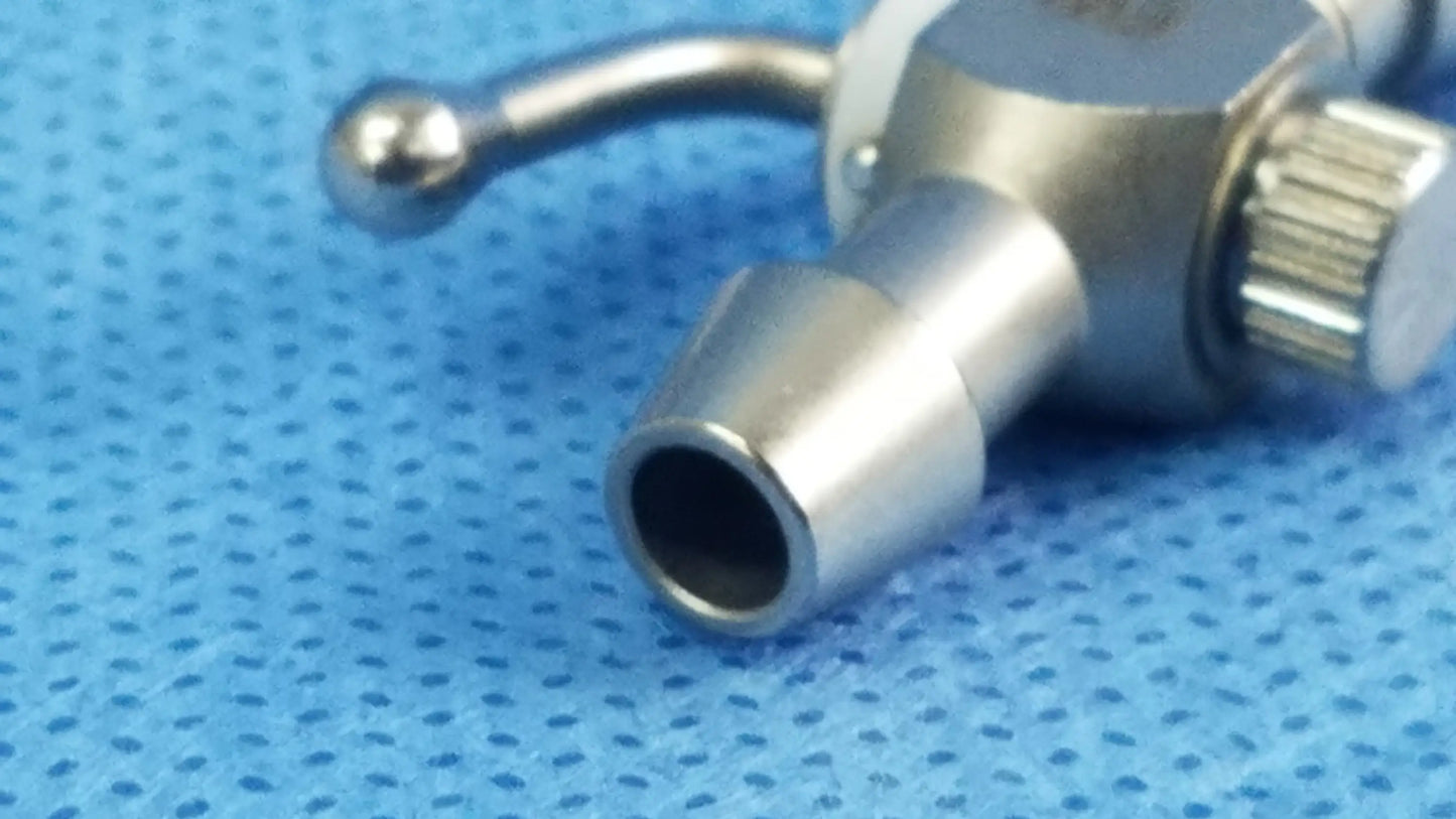 Silver metallic 75u universal stopcock with textured knob and rounded handle for fluid management in OBGYN and urology
