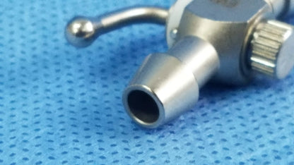 Silver metallic 75u universal stopcock with textured knob and rounded handle for fluid management in OBGYN and urology