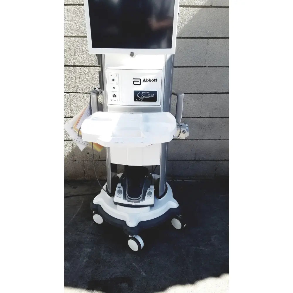 Abbott whitestar signature phacoemulsification system with white and silver touchscreen control panel and wheeled base