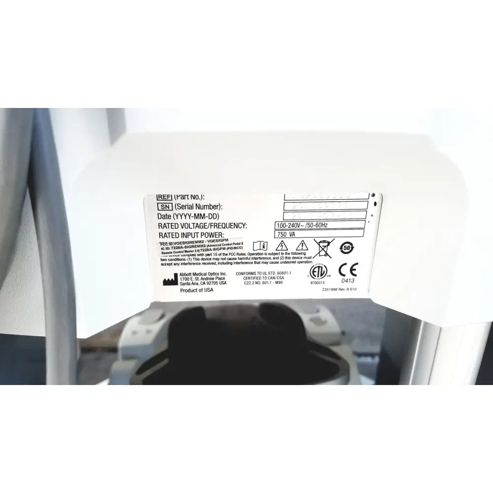 White plastic label with black text and certification marks on the back of abbott whitestar signature phacoemulsification system