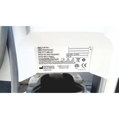 White plastic label with black text and certification marks on the back of abbott whitestar signature phacoemulsification system