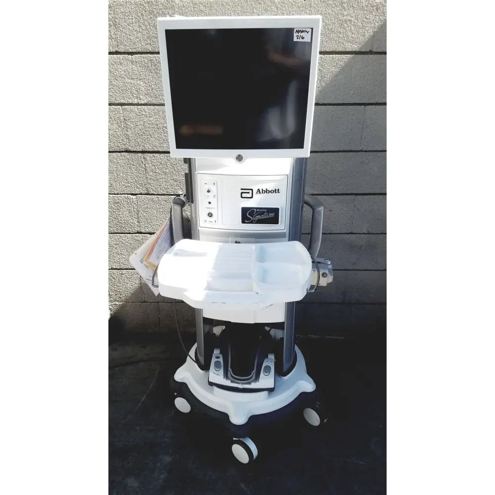 White and gray abbott whitestar signature phacoemulsification system with touchscreen on wheeled medical diagnostic cart