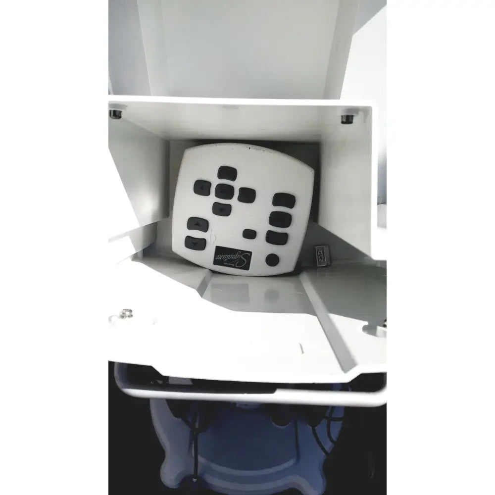 White plastic control panel with black buttons and simplicity logo of abbott whitestar signature phacoemulsification system
