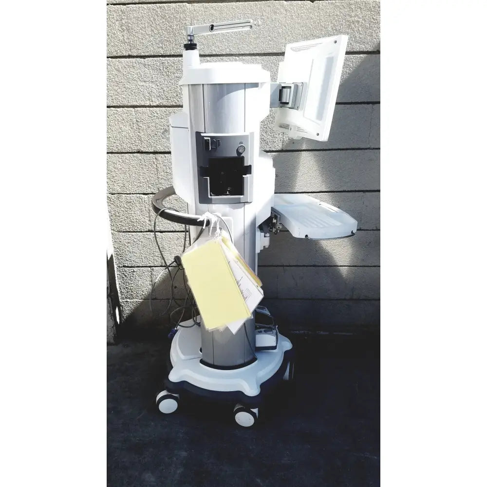 White and silver medical-grade abbott whitestar signature phacoemulsification system with mounted monitor and wheeled base