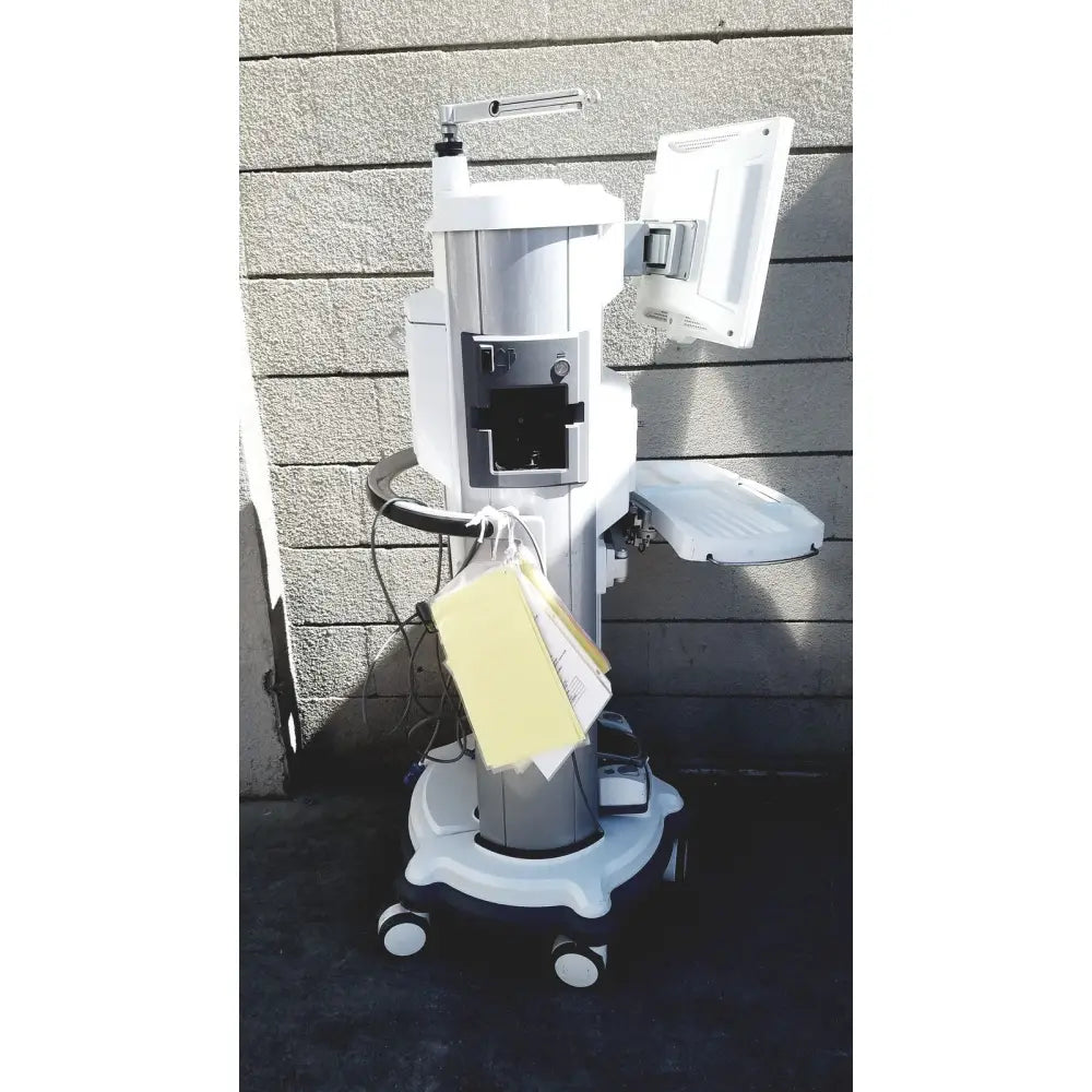 White and gray medical-grade abbott whitestar signature phacoemulsification system with monitor and wheeled base