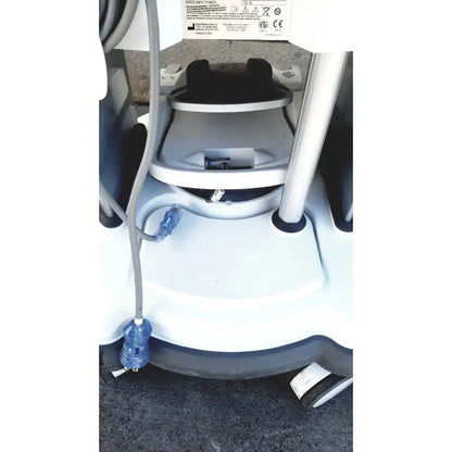 White medical cart with black accents and blue electrical connectors of abbott whitestar signature phacoemulsification system