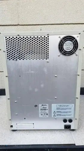 Silver metallic industrial fan unit with perforated panel on the back of the abi prism 7000 sequence detection system