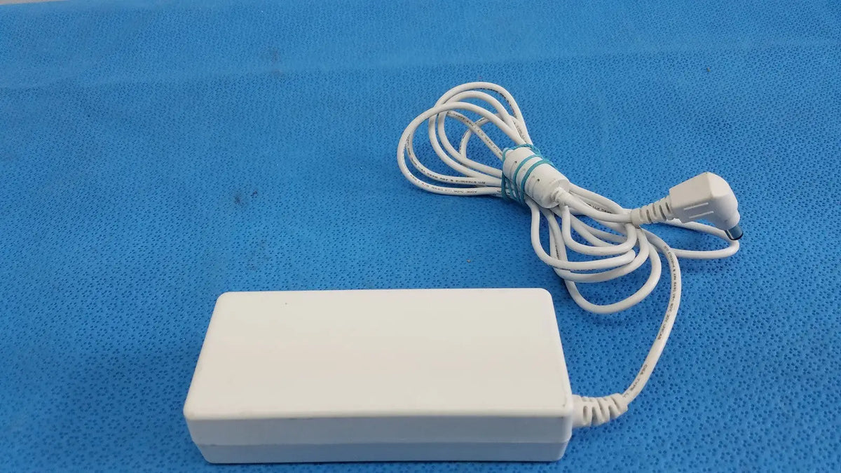 White rectangular power adapter sed80n2-24 with coiled white cable and bundled plug for 24v 2.65a output