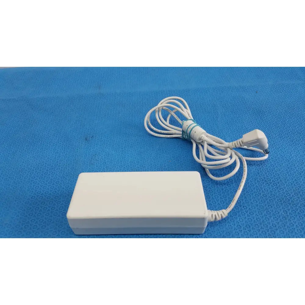 White rectangular power adapter sed80n2-24 with coiled white cable and bundled plug for 24v 2.65a output