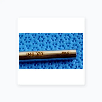 A sleek metallic cylindrical tool with engraved markings in the ace 765-1001 sterilization tray for dental implant use
