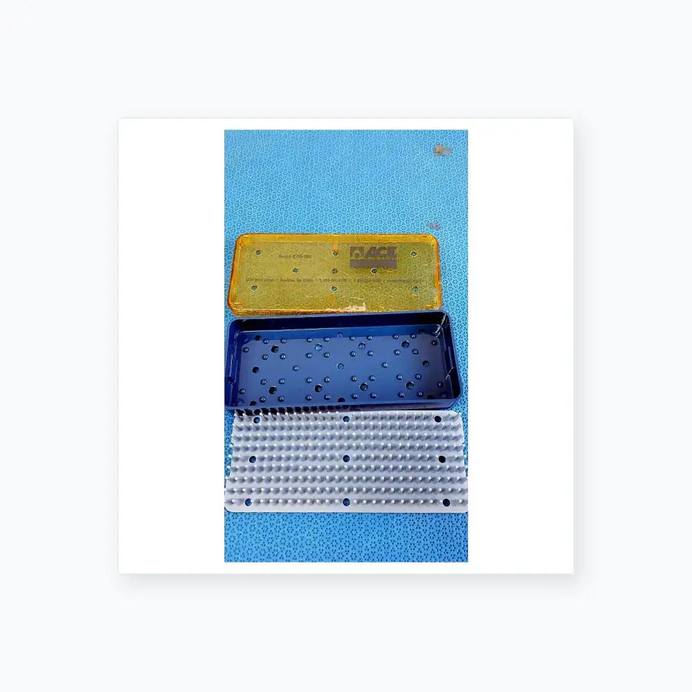 Blue plastic sterilization tray with perforated surface and matching lid for straumann dental implant surgical kit medical equipment