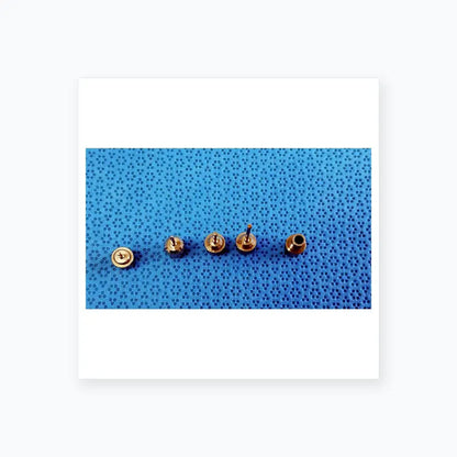 Five metallic rivets with varying designs for ace 765-1001 sterilization tray in dental implant surgical kit medical equipment