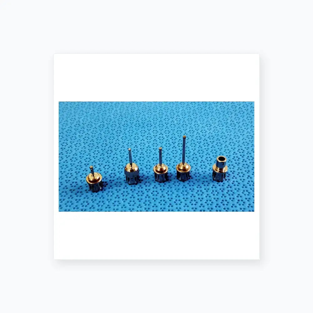 Set of five metallic dental implant screwdrivers with textured handles in ace 765-1001 sterilization tray medical equipment