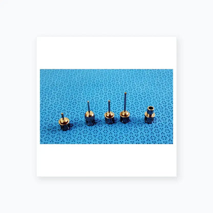 Set of five metallic dental implant screwdrivers with textured handles in ace 765-1001 sterilization tray medical equipment