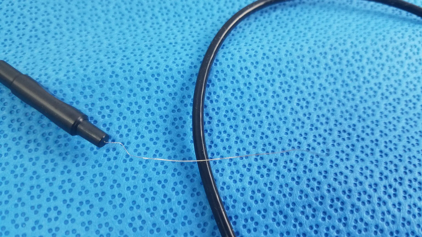 Black cable with thin metallic wire extending from sterlization tray with stryker 8400-815-005 multigen radiofrequency probe