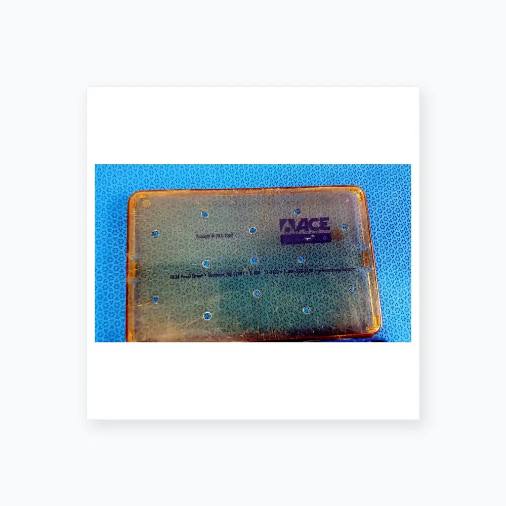 Transparent yellow plastic sterilization tray with blue dot grid and branding for Stryker multigen radiofrequency probe
