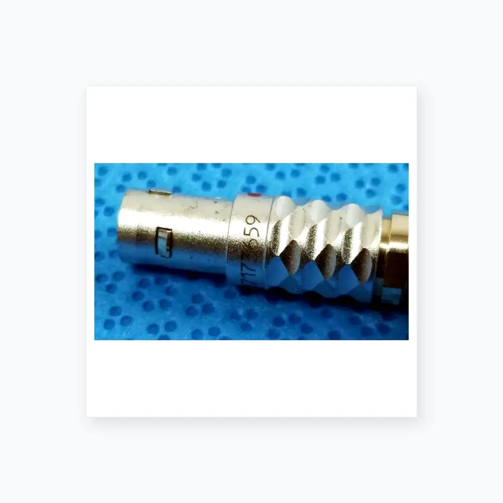 Silver metallic coaxial connector with threaded ridged body and serial number for ace 765-1002 sterilization tray with multigen radiofrequency probe