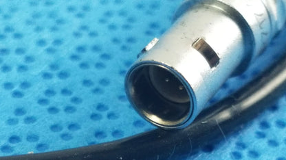 Silver-colored xlr audio connector with black cable attached to ace 765-1002 sterilization tray for multigen radiofrequency probe