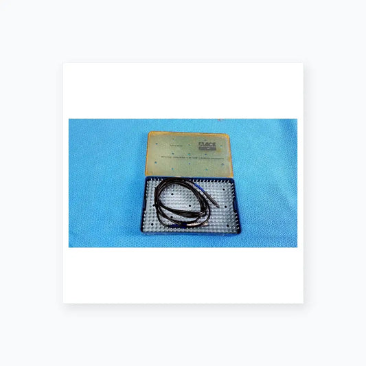 Black coiled cable with blue connectors in a blue and beige sterilization tray for Stryker multigen radiofrequency probe