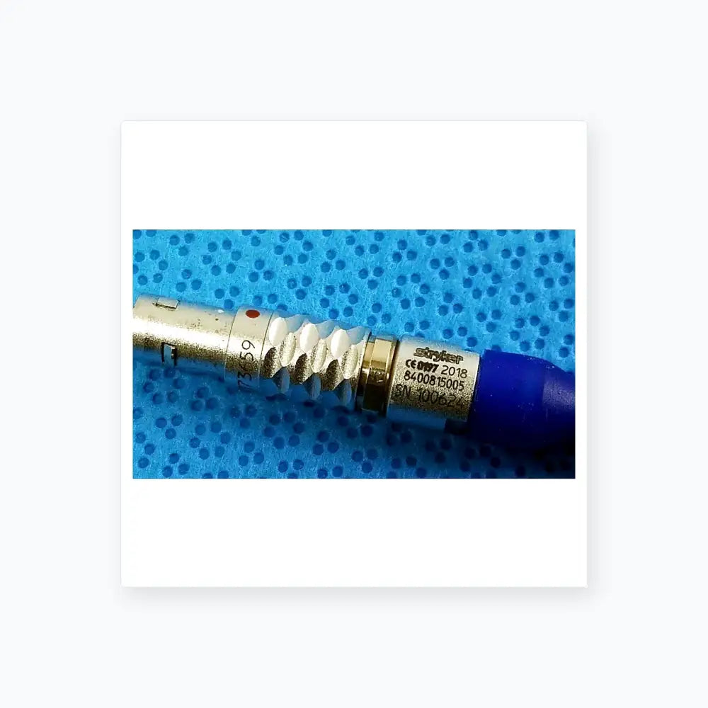 Silver metallic medical connector with blue cap engraved stryker serials for multigen radiofrequency probe sterilization tray