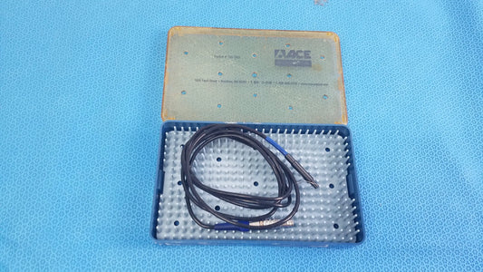Black coiled cable with blue connectors in a blue and beige sterilization tray for Stryker multigen radiofrequency probe