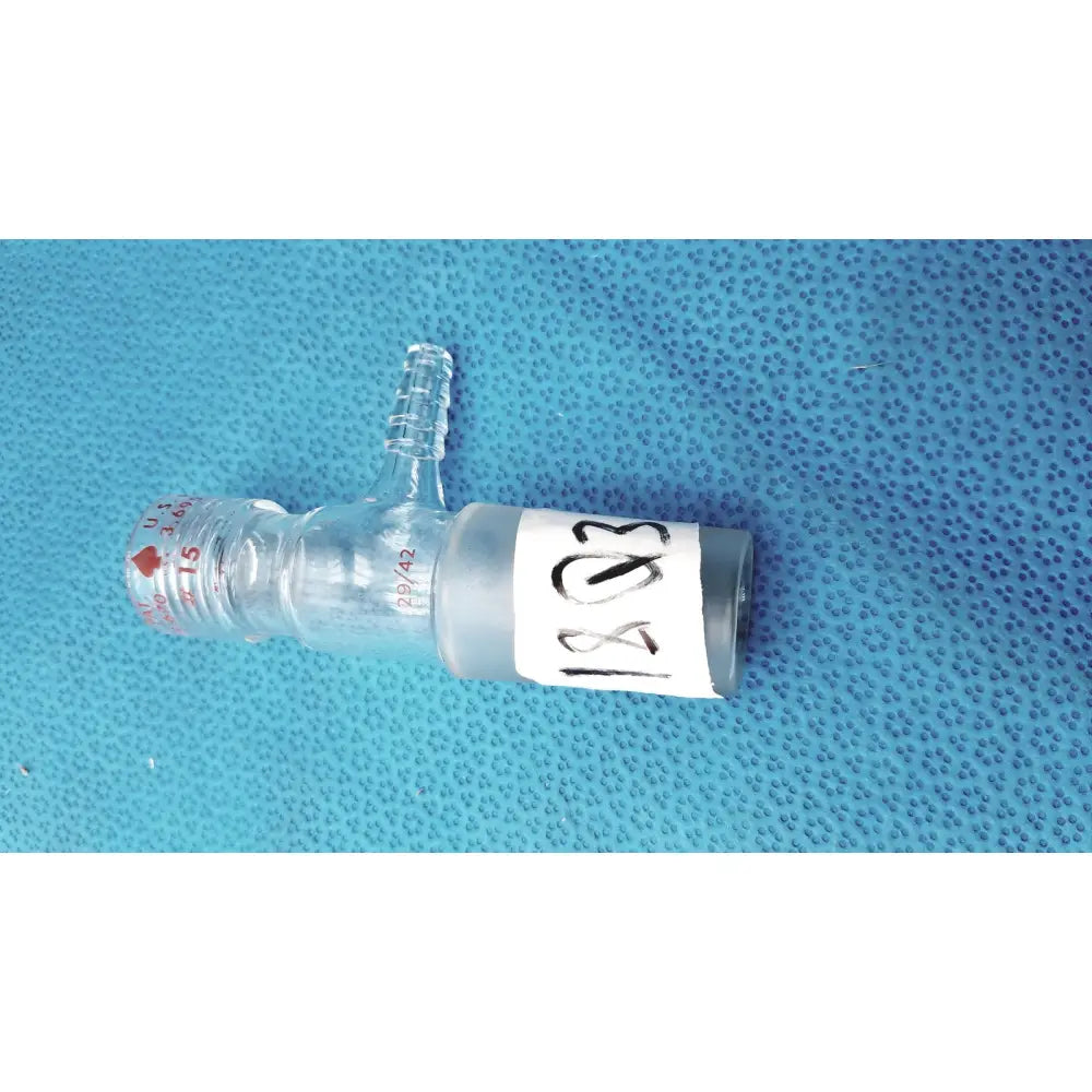 Clear glass ace glass inlet adapter with side tube, measurement markings, and white label for laboratory glassware 24/40 joint