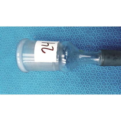 Clear plastic ace glass enlarging adapter vial with white 24 label and dark gray cap made of borosilicate glass