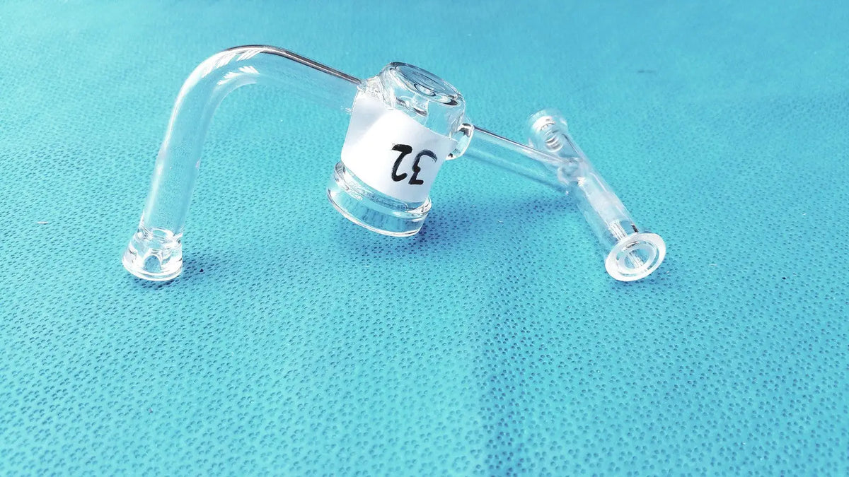 Clear glass ace glass straight bore stopcock with curved arm and white ce label made of borosilicate lab glass