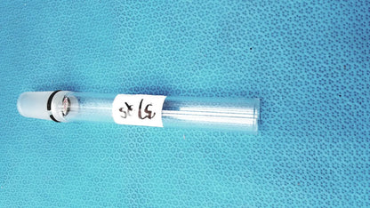 Clear glass thermometer adapter by ace glass with white cap black band and thin metallic rods for ace glass thermometer use