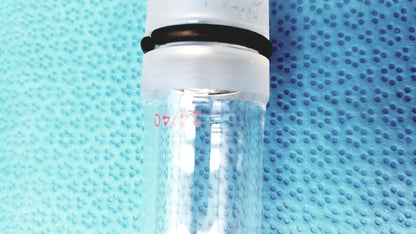 Clear glass ace glass thermometer adapter graduated cylinder with white plastic lid and black rubber band inner 24/40 joint