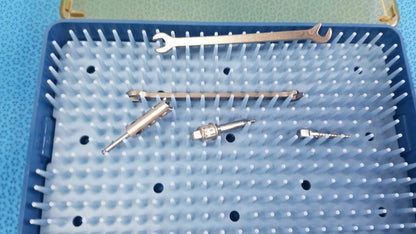 Blue plastic tray holding ace ophthalmology micro surgery surgical instruments for reuse medical equipment by smiths medical