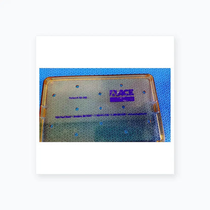 Clear plastic surgical tray with gold edges and purple ace logo for reuse medical equipment in ophthalmology surgery