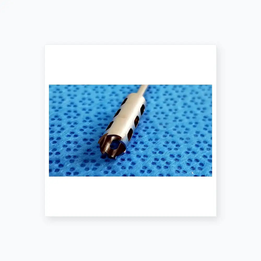 Silver-colored surgical drill bit with circular cutouts and serrated tip from ace ophthalmology micro surgery medical equipment by smiths medical
