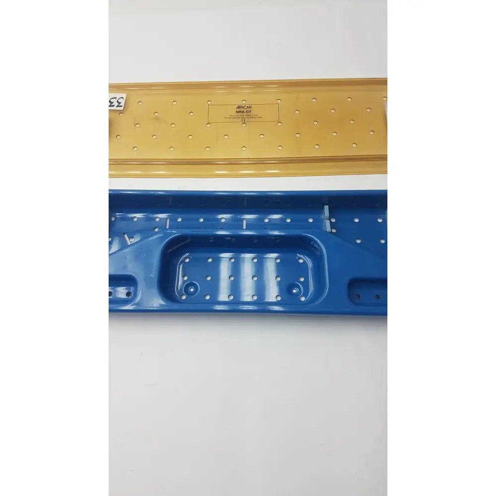 Acmi mra-gt slimline blue and yellow plastic storage tray with perforated surfaces and molded compartments for sterilization