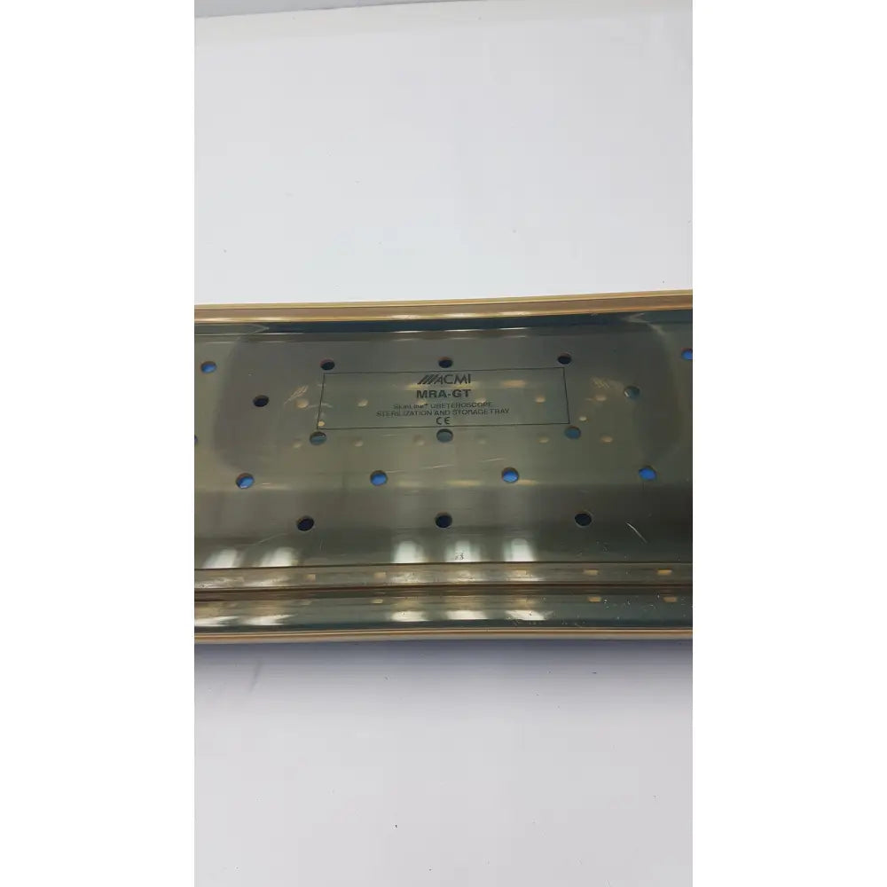 A metallic brushed acmi mra-gt slimline sterilization storage tray with rectangular shape and circular ventilation holes