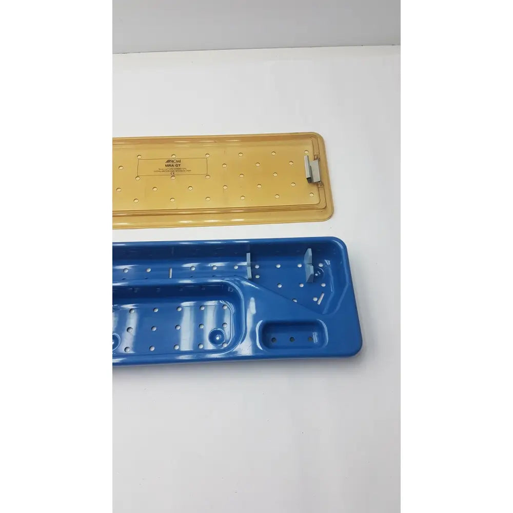 Acmi mra-gt slimline storage tray with blue and yellow plastic perforated surfaces for slimline sterilization use