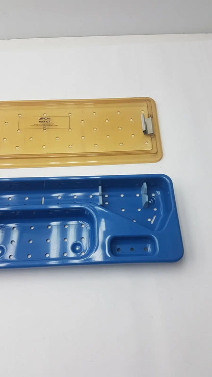 Acmi mra-gt slimline storage tray with blue and yellow plastic perforated surfaces for slimline sterilization use