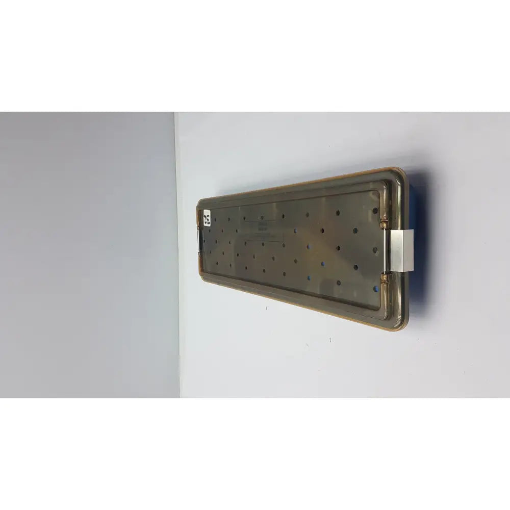 Rectangular metallic ACMI MRA-GT slimline sterilization tray with grid holes and reinforced edges for sterilization use