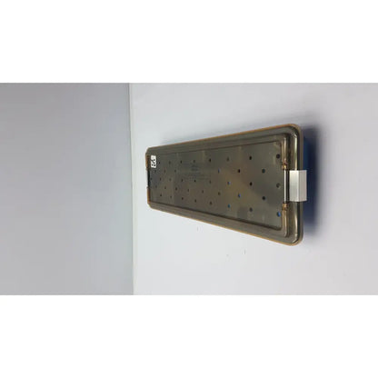 Rectangular metallic ACMI MRA-GT slimline sterilization tray with grid holes and reinforced edges for sterilization use