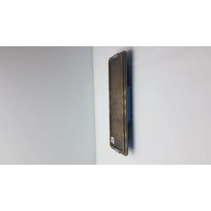 Acmi mra-gt slimline sterilization tray with a matte bronze metallic surgical plate featuring evenly spaced perforations