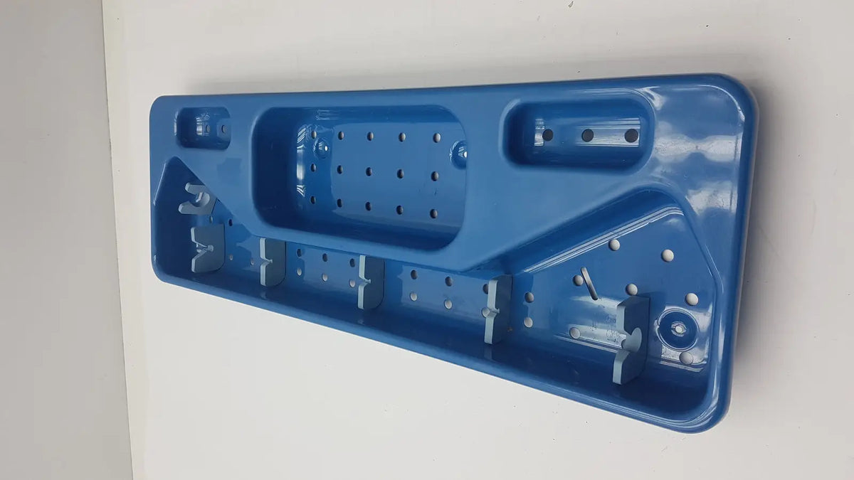 Blue plastic wall-mounted tool organizer with compartments and hooks for acmi mra-gt slimline sterilization tray use