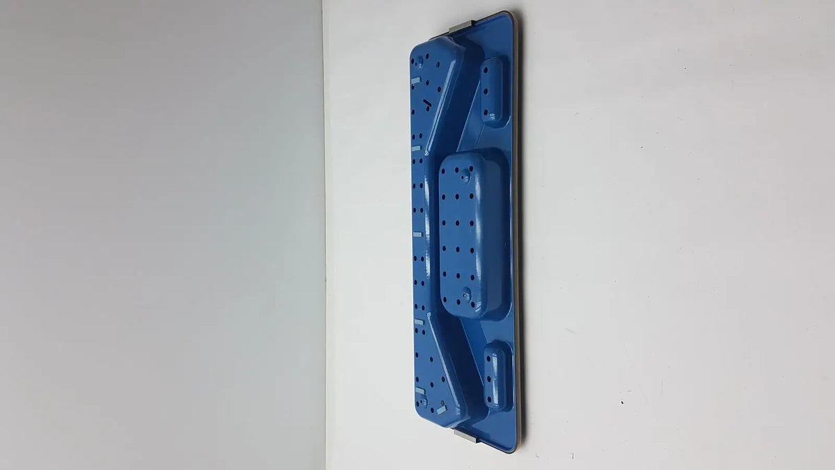 Blue plastic wall-mounted storage rack with compartments and perforated sections for acmi mra-gt slimline sterilization tray