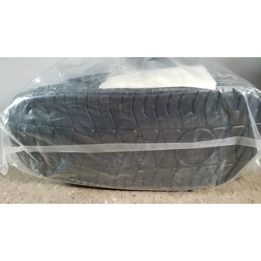 Black rubber tire with deep treads wrapped in clear plastic for actimove standard walker boot achilles large right left