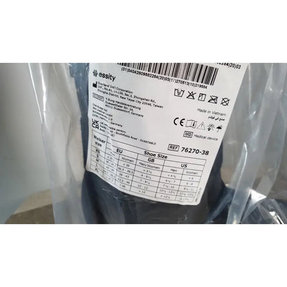 The label on clear plastic packaging for actimove standard walker boot achilles high large showing size charts and manufacturing details